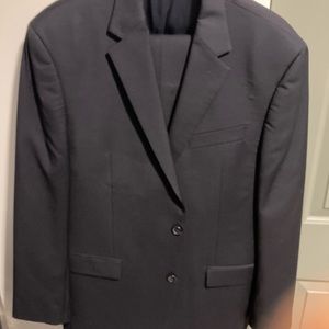 Mens navy blue classic Calvin Klein suit. Timeless style.